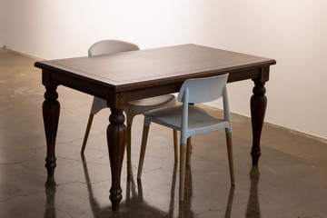 Classical tables and modern chairs.