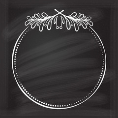 Vector round dotted frame with mistletoe leaf decoration on a chalkboard background. Christmas vintage style template.