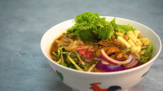 Assam Laksa (Noddle in Tangy Fish Gravy) is a Special Malaysian Food Popular in Penang