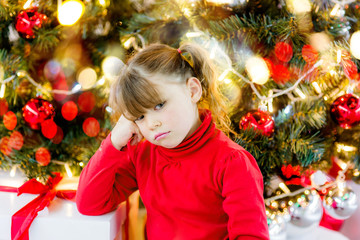 beautiful girl waiting for the opening of gifts