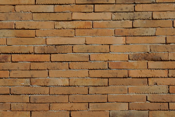 Fototapeta premium Brown clay brick wall