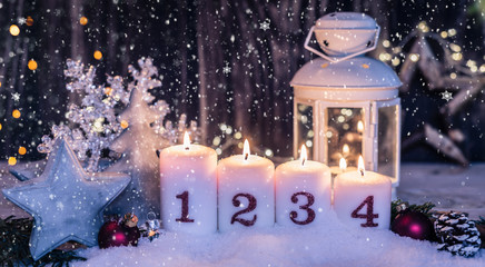 burning candles in romantic christmas mood on the holy evening