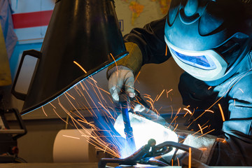 Industrial steel welder in factory welder, craftsman