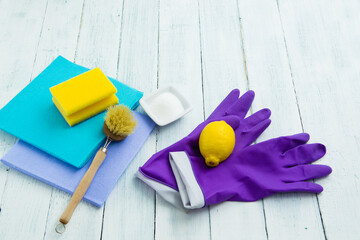dishwashing tools and citric acid, lemon on white wooden