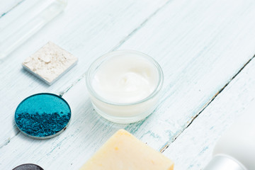 Fototapeta na wymiar hygiene and beauty product samples, powder compact, spray, soap, moisturizer