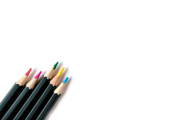 Colored pencils on white isolated background