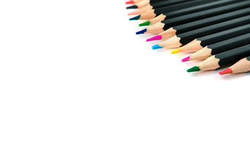Colored pencils on white isolated background