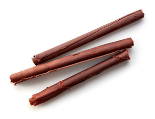 chocolate sticks on white background