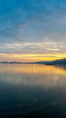 sunset over a frozen lake
