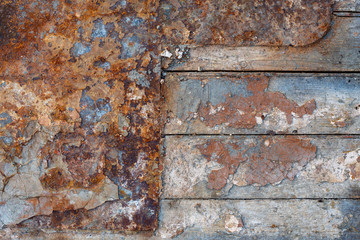 Texture of old wooden planks and rusty iron. Rough dirty surface of metal and wood. Perfect for background and design.