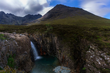 Fototapeta na wymiar One of natural waterfalls phenomenon of The Fairy Pools in Glen Brittle on the Isle of Skye , Scotland