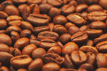 Roasted coffee beans, can be used as background. Soft contrast.
