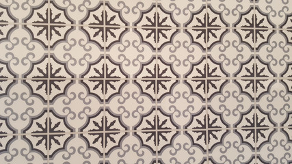 Ornate brightly colored portuguese tile texture in brown white