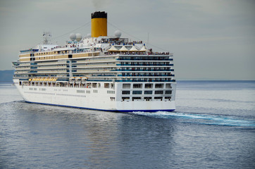 Italian cruise ship or cruiseship liner Costa Cruises Costa Deliziosa at sea departing Greek Island...