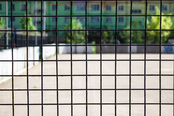 abstract background with squares. metal grill, loneliness, locked up, social loneliness.