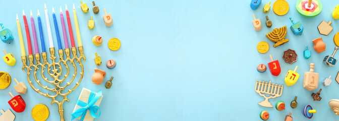 religion image of jewish holiday Hanukkah background with menorah (traditional candelabra) and spinning top