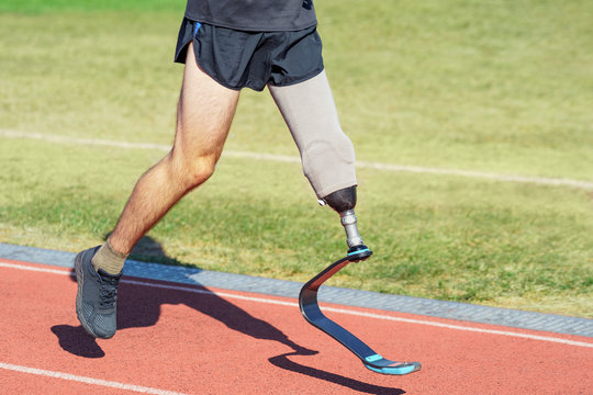 Runner with a prosthetic leg. Amputee sportsman