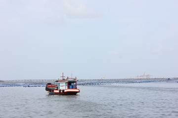 Fototapeta premium fishing boat in the sea and clear blue sky