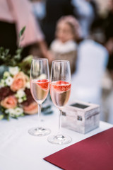Strawberry in champagne in glasses