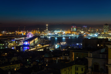 Fototapeta na wymiar GENOA, ITALY, NOVEMBER 5, 2019 - Aerial view of Genoa, Italy at night, the harbor with the hiistoric centre, Italy, Europe
