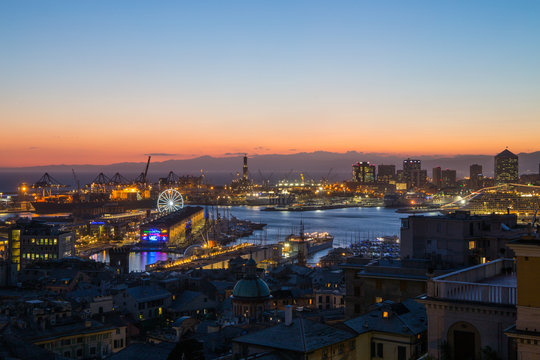 GENOA, ITALY, NOVEMBER  5, 2019 - Aerial view of Genoa, Italy at dusk, the harbor with the hiistoric centre, Italy, Europe