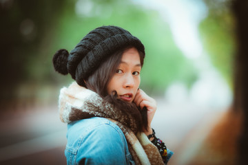 Fototapeta premium Charming Asian woman portrait in autumn season