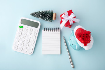 Christmas piggy bank with calculator and notepad