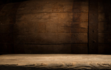 Old wooden barrel on a brown background