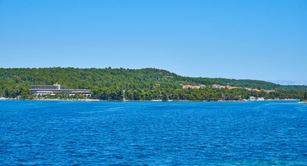 Beaches of Hvar, Croatia; turquoise waters, green pine trees and rocks                               