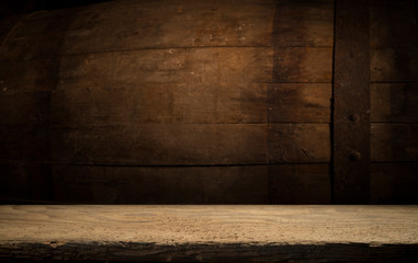 Old wooden barrel on a brown background