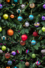 Obraz na płótnie Canvas Seamless pattern of Christmas tree branchrs with balls. Close up