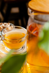 Hot refreshing citrus tea in glass close up