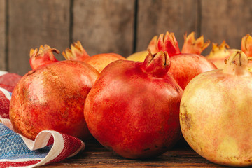 Group of pomegranate fruits close up background