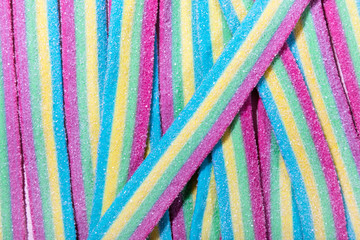 Background from bright lying multicolor candies close-up