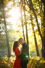 Beautiful couple in the autumn forest