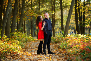 Fototapeta premium Beautiful couple in the autumn forest