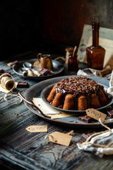 homemade chocolate cake with melted chocolate and chocolate flakes