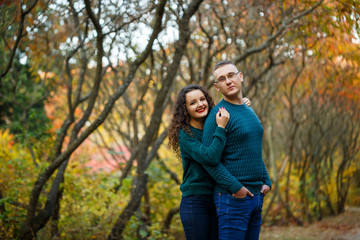 Fototapeta premium Couple in sweaters in the autumn park