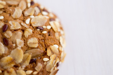 close up homemade backed cereal oat cookie on white background. macro healthy food photography