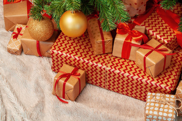 Fototapeta na wymiar Stack of wrapped presents under Christmas tree