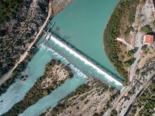 Dam at the mountain river and river island