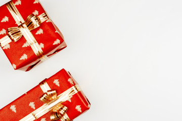 Top view, flat lay of red Christmas gifts on white background