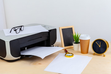 Office printer close up on a wooden table
