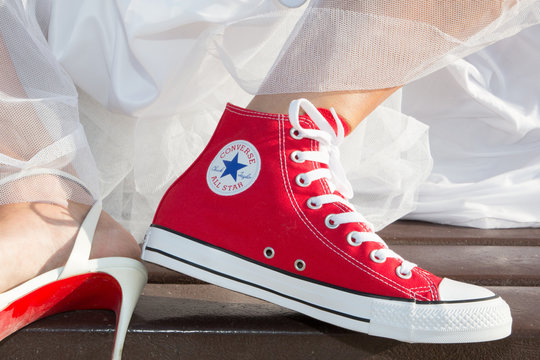 Bride feet Wedding Dress and red Sneakers converse all star chuck taylor