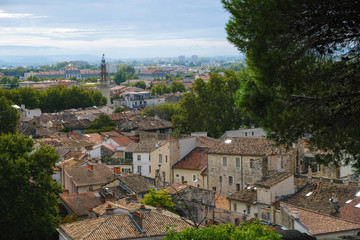 Fototapeta na wymiar Documentary image. Avignon. Provence. France. October 25. 2019. Avignon orange tile roofs after rain in sunlight. The reflection of the sun in the windows on the roofs of houses. Tourist Provence.