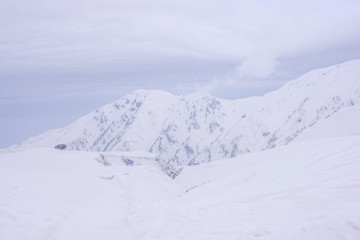 Fototapeta na wymiar Tateyama mountain range and snow at the Alpine Route, Tateyama-Kurobe