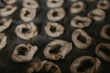 raw donuts or donuts on the baking sheet