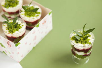  Sweet dessert triffle in cups and a box on the table. English recipe, cooking