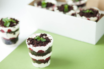  Dessert trifle on a table with raspberry syrup, spinach and cream. English cuisine. Confectionery.