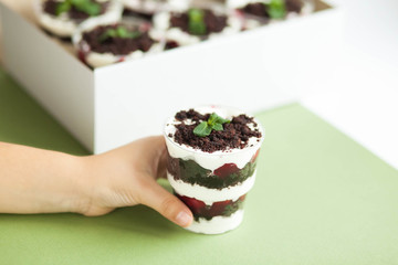  Dessert trifle on a table with raspberry syrup, spinach and cream. English cuisine. Confectionery.